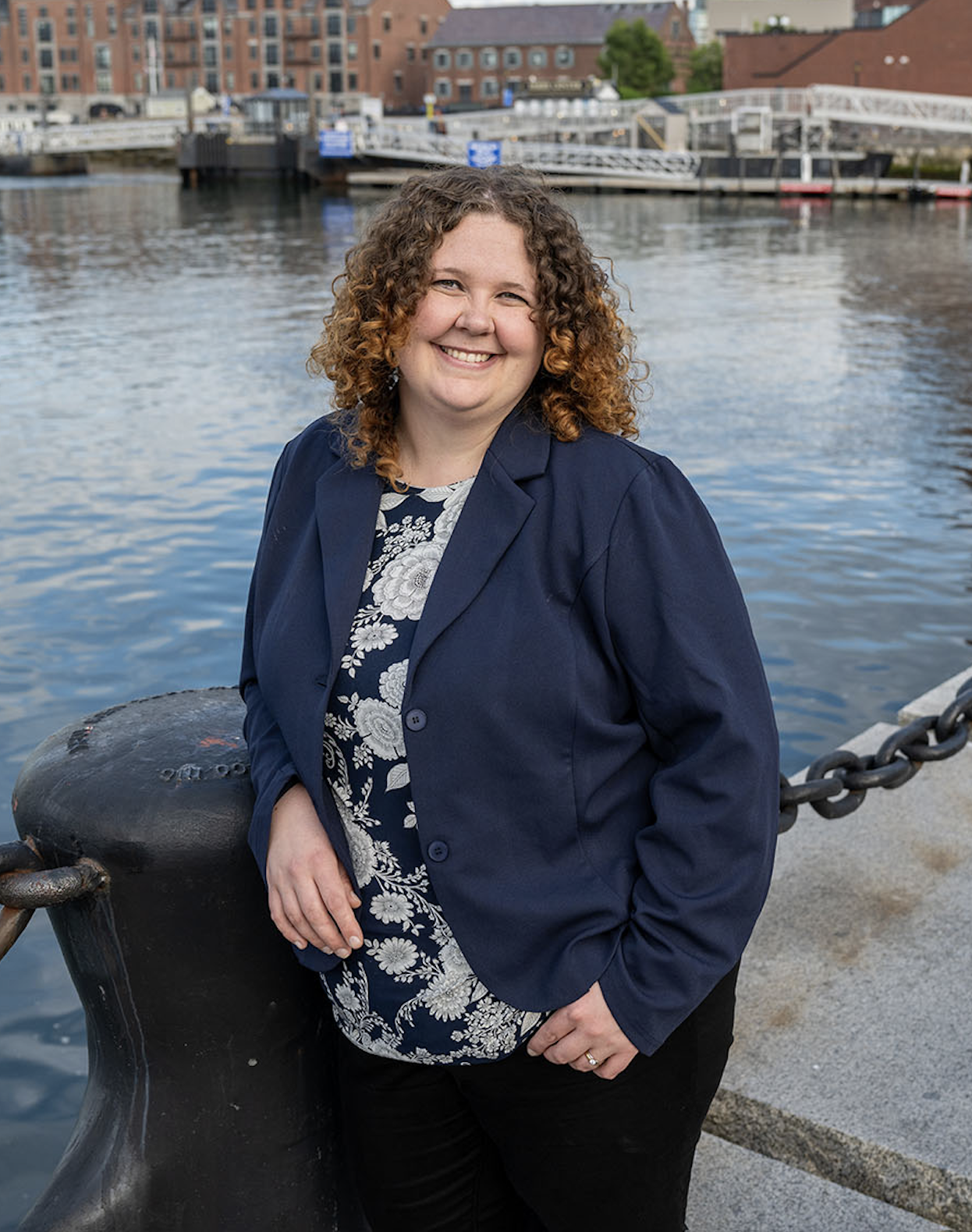 Genna Kane posing in front of Boston's ports